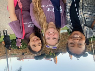 Megan Fletcher pictured with two of her fellow students in front of a stone structure in South Africa.
