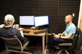 Ph.D. student Donnie Dunagan and Dr. Chacón run an experiment on the EEG machine. 