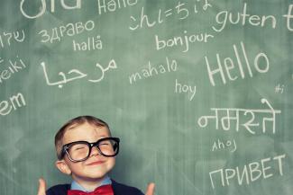 Baby in front of blackboard